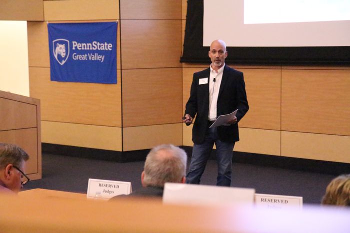 Wayne Frick, founder of Chirpsounds, presents his product at Penn State Great Valley's Lion Cage competition