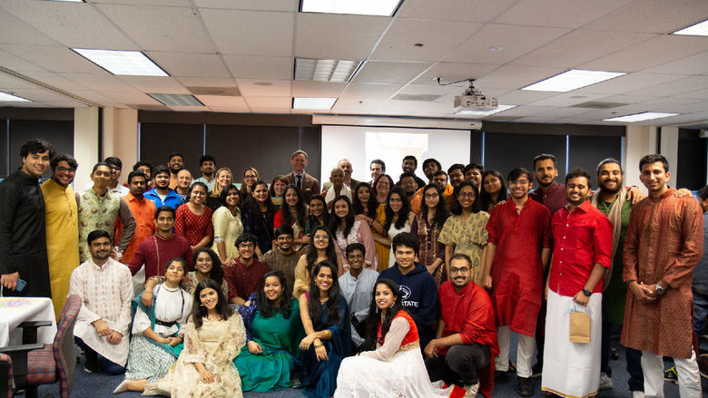 A group of students, staff, and faculty dressed up for Diwali