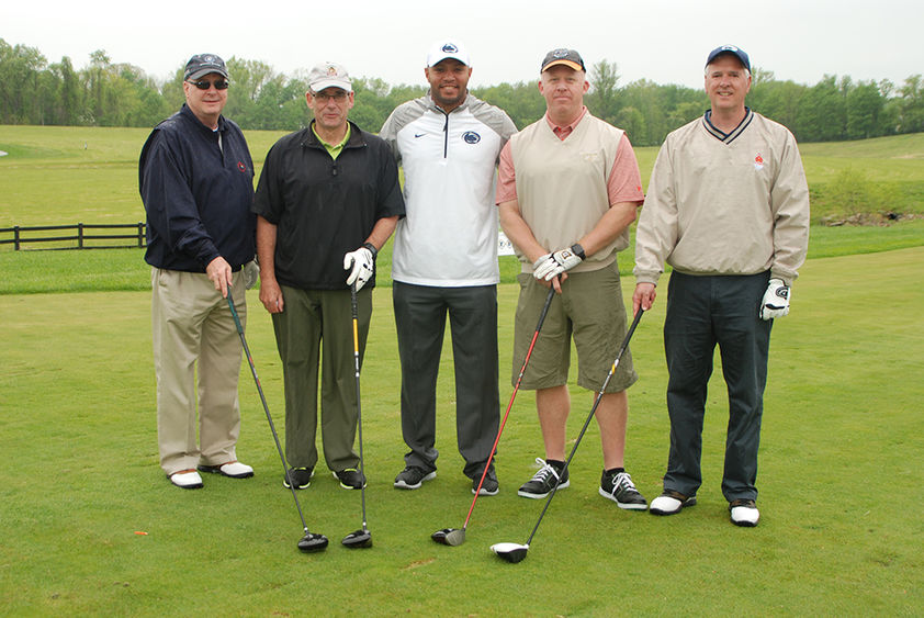 Photo of golfers with Coach Gattis