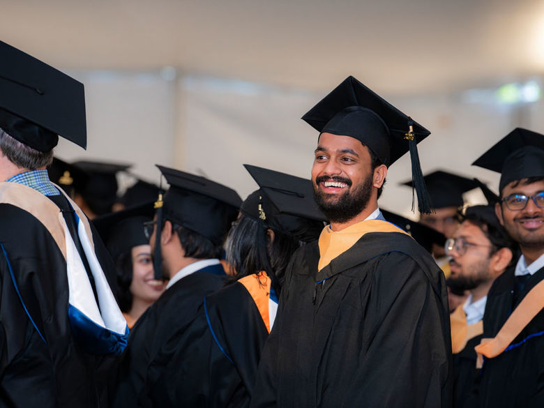 Smiling graduate at commencement