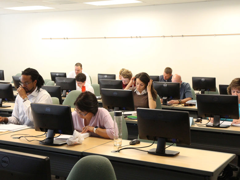 Students working at computers at desks