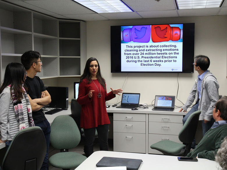 Students present a project in the campus' Big Data Lab
