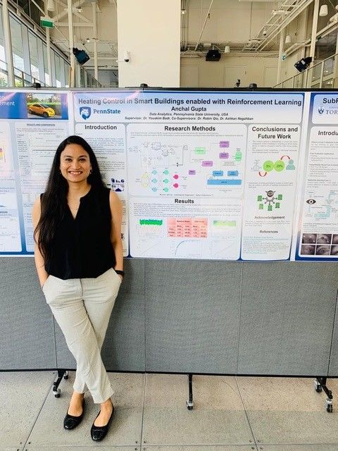 Anchal Gupta in front of her poster presentation
