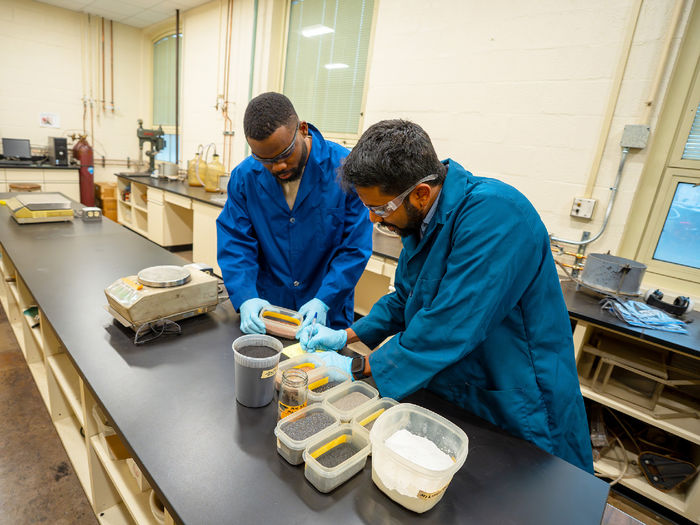people in lab looking at equipment