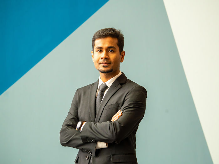 person standing in front of abstract background
