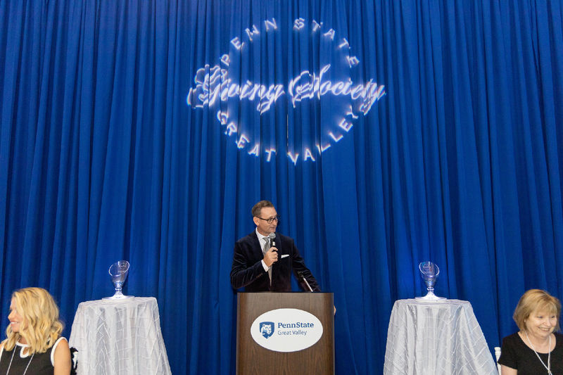 Colin Neil speaking at a podium at the Great Valley Celebrates event