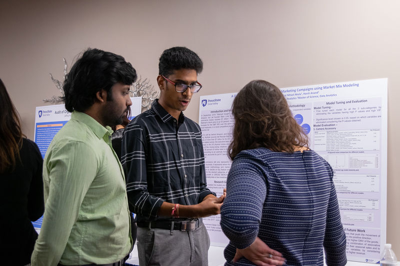 Students discuss their research