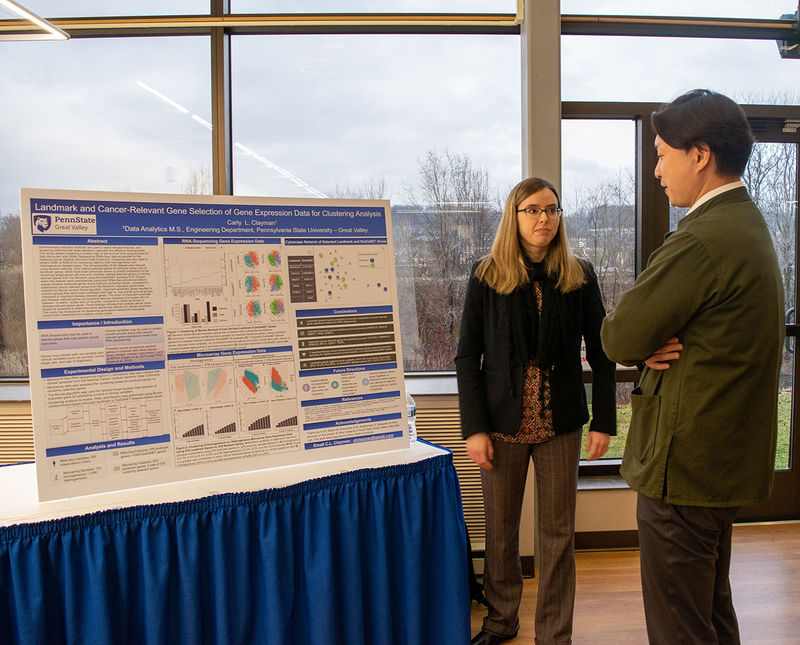 A student explaining her research to a judge
