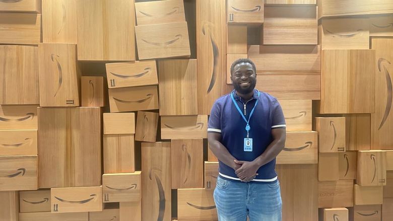 An intern stands in front of a display at Amazon in Seattle  