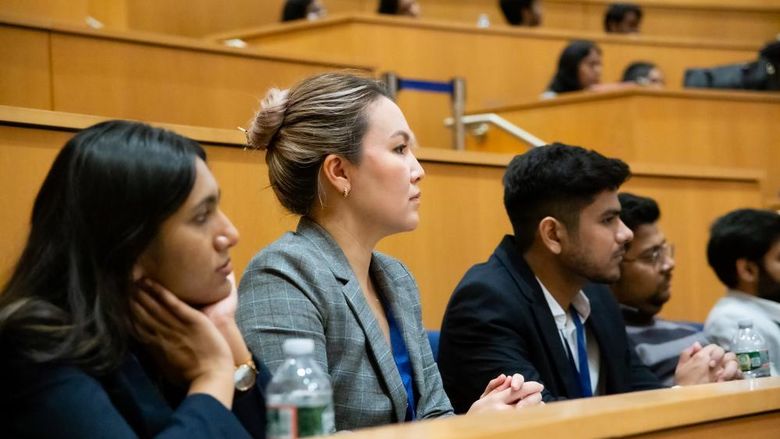 Graduate students listen to global careers presentations