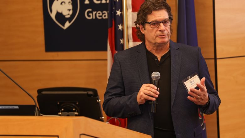 man speaking into microphone