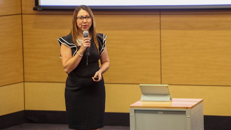 woman speaking into microphone