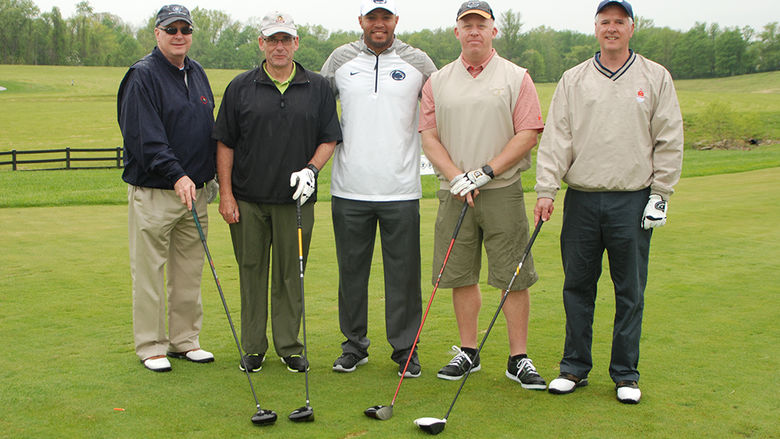 Photo of golfers with Coach Gattis