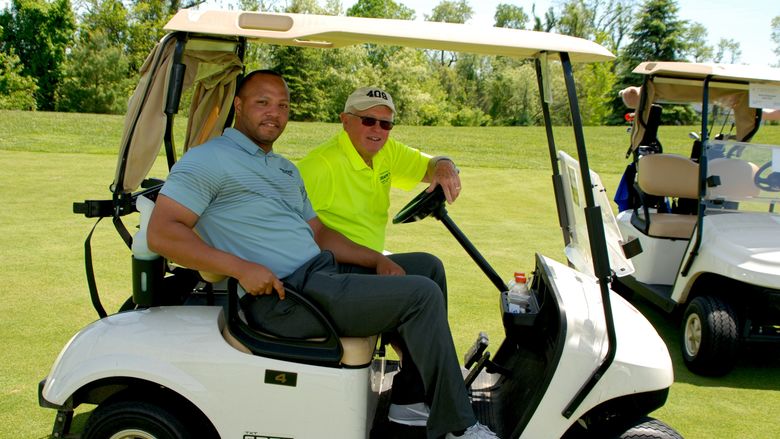 Josh Gattis and Dallas Krapf in golf cart