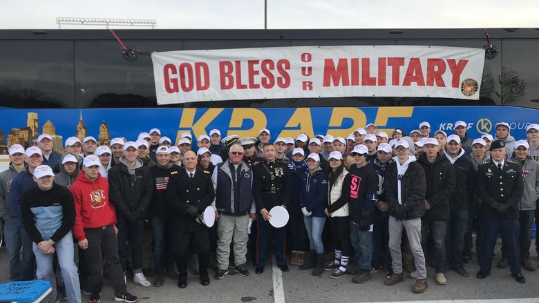 Naval ROTC poses in front of bus