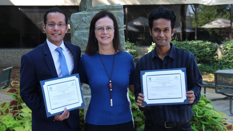 Penn State Great Valley graduate students Mohamed Megahed and Pratik Pachpute show off their ASEE awards with professor Kathryn Jablokow