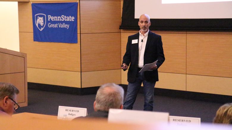 Wayne Frick, founder of Chirpsounds, presents his product at Penn State Great Valley's Lion Cage competition