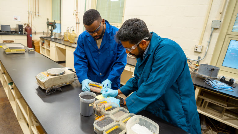 people in lab looking at equipment