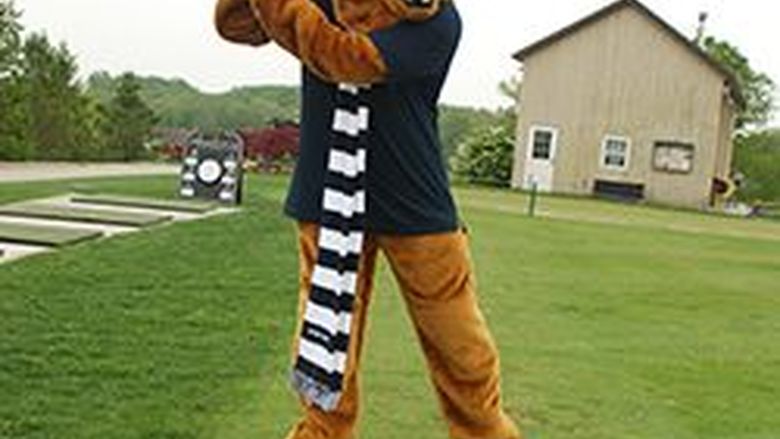 Nittany Lion swinging a golf club