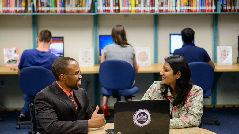 Student meeting with an academic program manager
