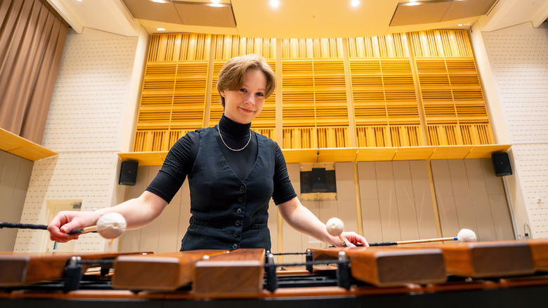 woman playing percussion instruments