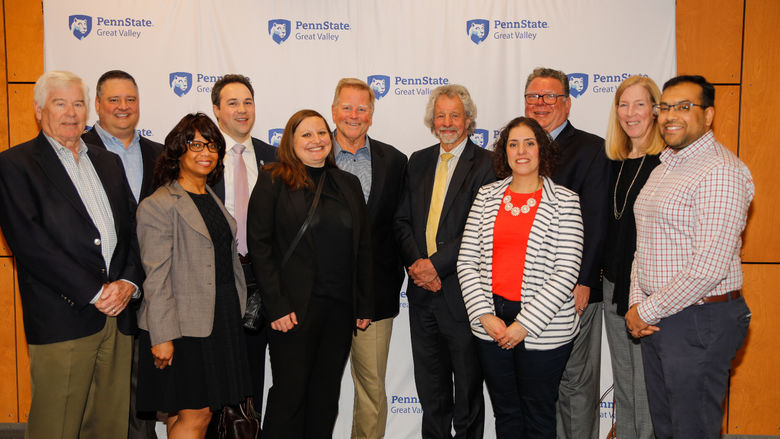 Members of Penn State Great Valley's Advisory Board pose for photo with Chancellor James Nemes