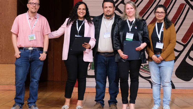 Five people receive awards for their research at an academic conference