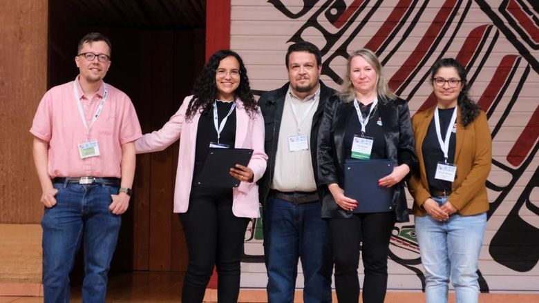 Five people receive awards for their research at an academic conference