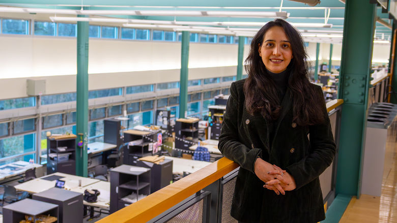 woman standing at railing in architecture studio building