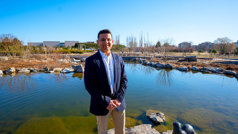 person standing in front of pond