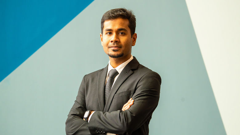 person standing in front of abstract background