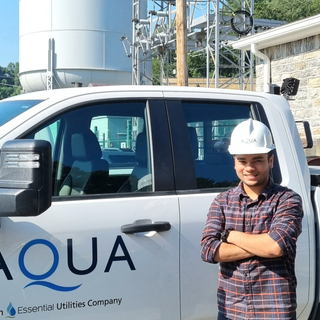 Utkarsh Singh in front of an Aqua truck