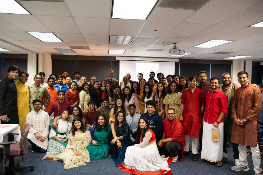 A group of students, staff, and faculty dressed up for Diwali