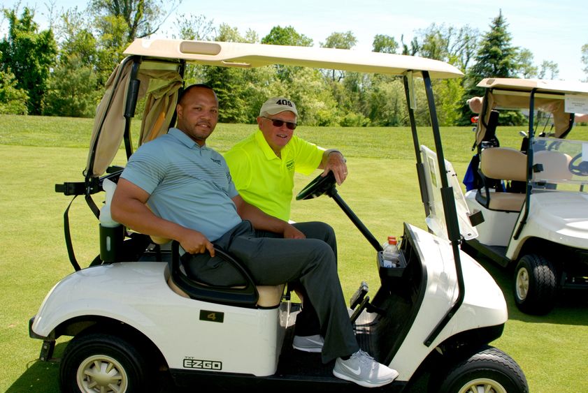 Josh Gattis and Dallas Krapf in golf cart