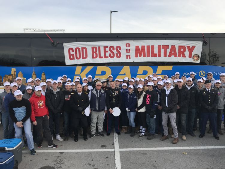 Naval ROTC poses in front of bus