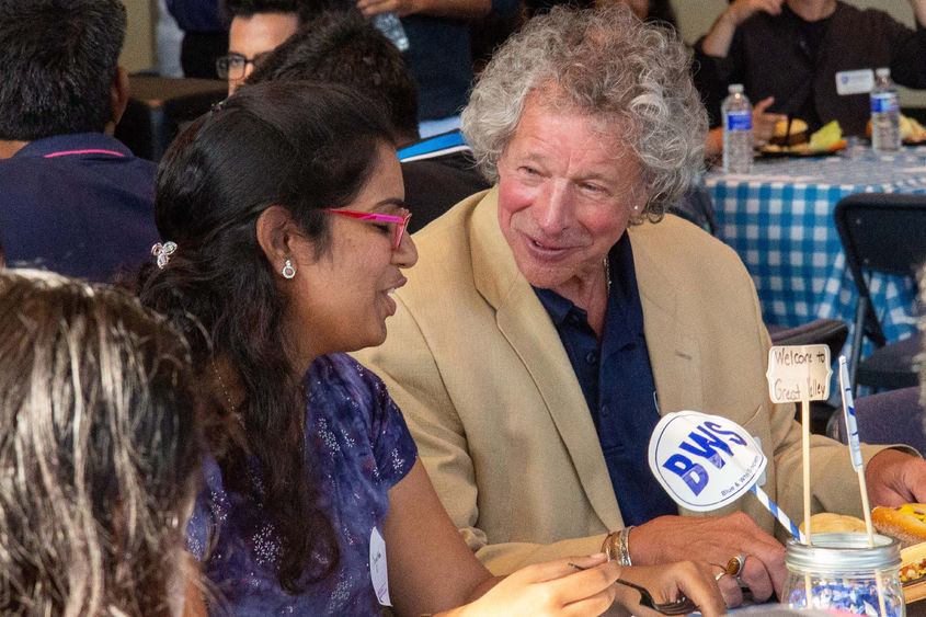 James Nemes talks with a student at the August 2019 international students BBQ