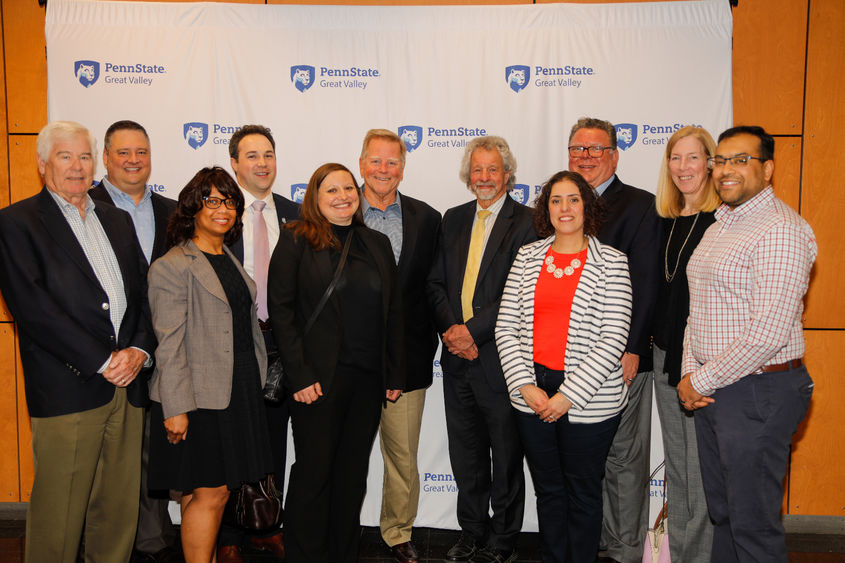 Members of Penn State Great Valley's Advisory Board pose for photo with Chancellor James Nemes